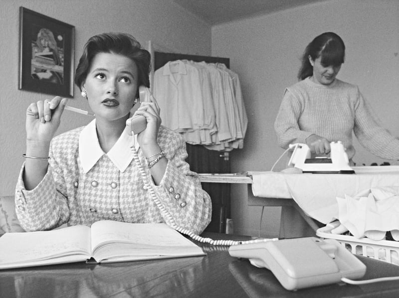 Wolverhampton entrepreneur Samantha Young, 22, takes customer calls at her desk in October 1992 while a colleague carefully irons freshly washed garments in the background. Spotting a gap in the local market, Samantha launched her dedicated ironing service to help busy residents who were "pressed for time." Quickly building up a loyal clientele of around 40 regular customers, her venture captured the vibrant spirit of small-scale enterprise flourishing across the city during the early 1990s. Have you ever used a local domestic service to help save time on the household chores, or did you run a small business in Wolverhampton back in the 90s?