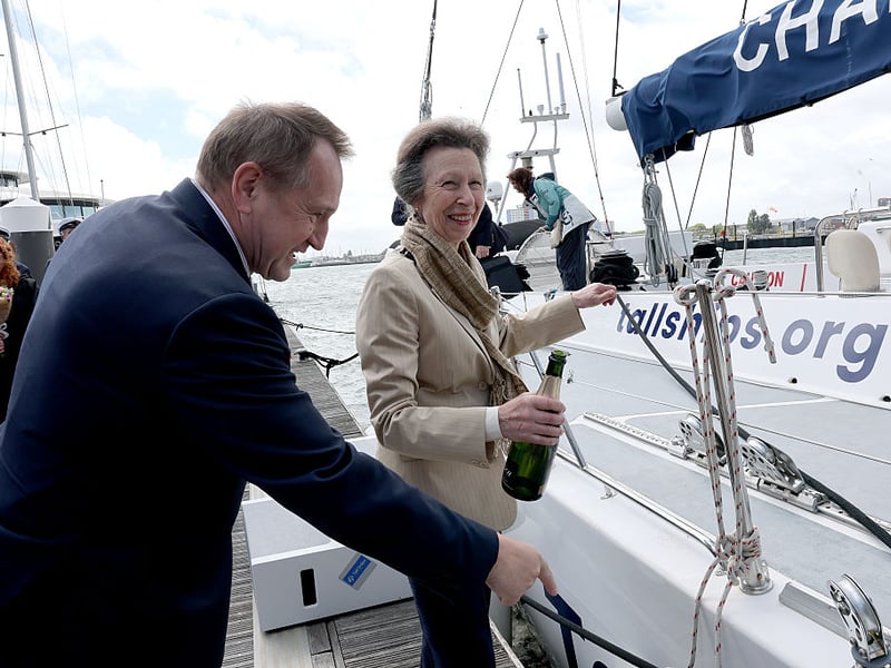 PORTSMOUTH, ENGLAND - JUNE 04: Princess Anne, Princess Royal prepares to pour Champagne on the Challenger 5 yacht with CEO Alastair Floyd during a visit to Tall Ships Youth Trust at Gunwharf Quays Marina on June 04, 2026 in Portsmouth. (Photo by Chris Jackson/Getty Images for Tall Ships Youth Trust)