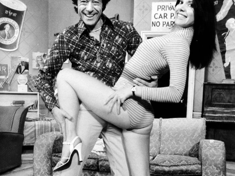 Lionel Blair gives dancing tips to Lindsay Adams on the stage of the Leeds Grand Theatre, where he was starring in Doctor in the House in September 1977.