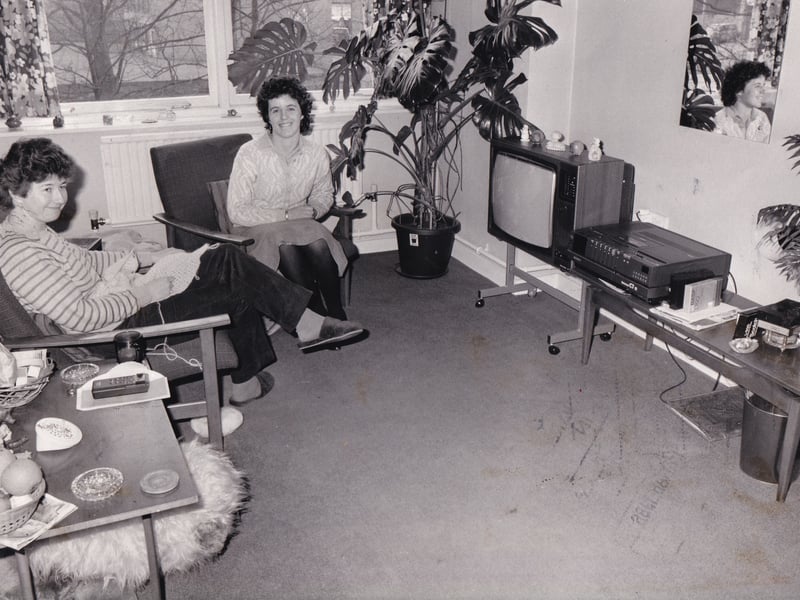 Defiant nurse Helen Carr, right, pictured in the lounge of her flat in the nurses' home at Newton Green Wing of Chapel Allerton Hospital with flatmate nurse Ann Leech in March 1986. Helen was determined to sit tight despite Leeds Western Health Authority now not able to offer her accommodation under new Government guidelines.
