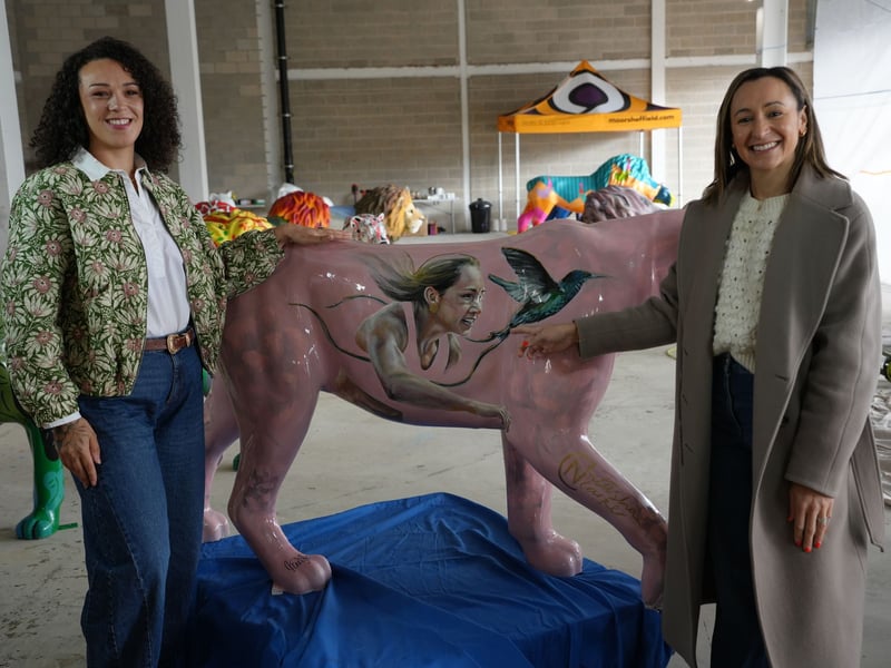 Sheffield Olympic champion Jessica Ennis-Hill with a lion in her likeness by artist Natasha Clarke.