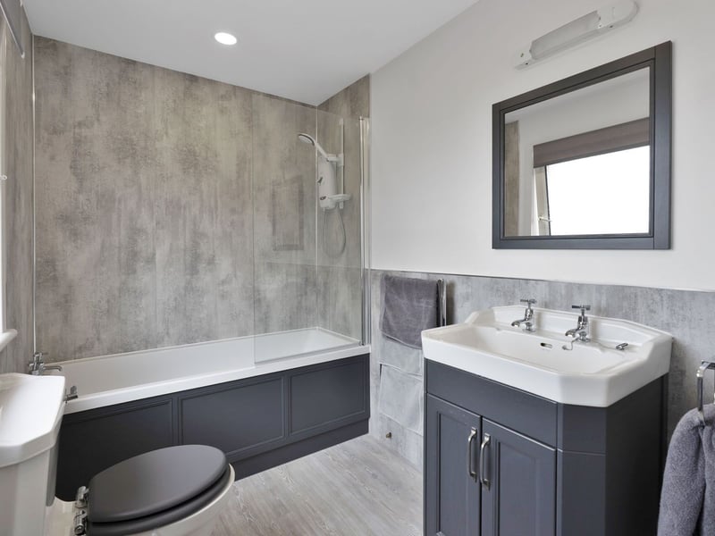 In addition to the en-suite and pool’s shower and WC, Brigadoon also has a family bathroom next to the first-floor bedrooms. Enjoying a stylish modern aesthetic, it features a three-piece suite and overhead shower.