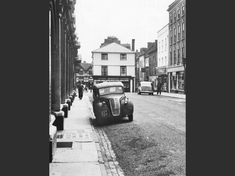 A nostalgic view of Castle Street in Ludlow, capturing the character of the town’s historic streetscape, possibly from the 1950s.
