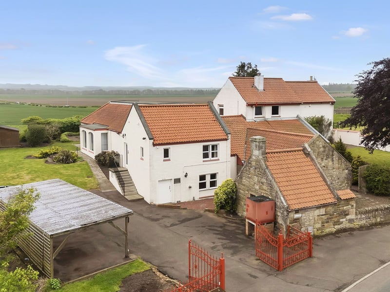 This large property also includes an equipment room, a generator room, a shed, and a garden room, as well as a gated driveway and carport which are both large enough to host multiple vehicles.