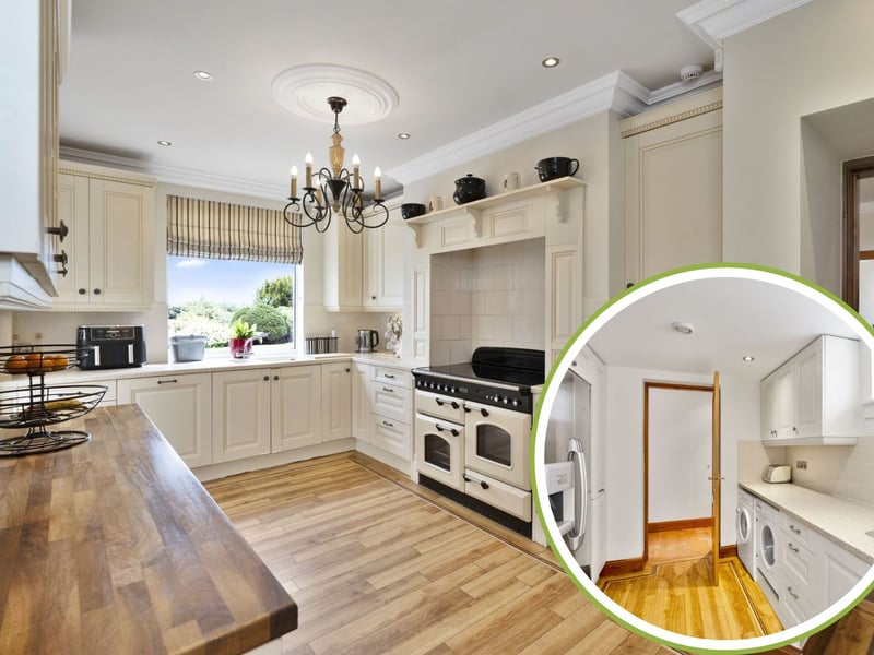 The kitchen features a beautiful combination of cream-coloured cabinetry alongside natural worktops in quartz and hardwood. It is complemented by a Rangemaster electric range cooker, an integrated dishwasher, and a built-in cupboard. Sat adjacent, a utility room has further cabinet storage and a quartz worksurface as well, providing space for additional freestanding appliances.