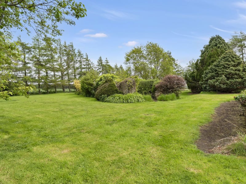 Brigadoon sits within an enclosed plot which includes suntrap wraparound gardens that are professionally landscaped. It features huge stretches of lawn, mature plants and trees, and charming dining areas. The open countryside backdrop adds to the peace and tranquillity while also ensuring complete privacy.