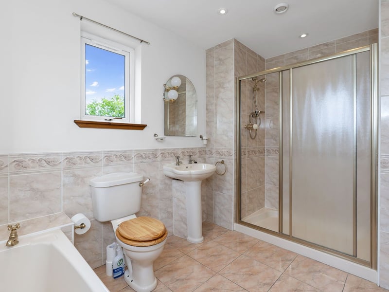 The property's principal bedroom is accompanied by a four-piece en-suite too, which includes a bath and a double-sized shower cubicle.