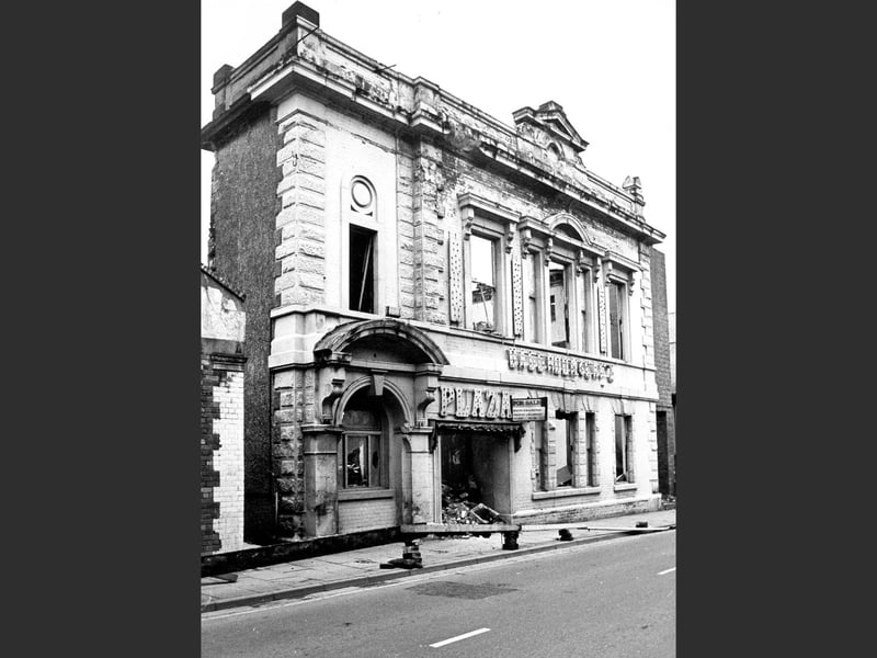 The Plaza in Oswestry during its demolition on 13 January 1975, captured at a moment when a familiar landmark was being taken down. Once a well-known feature of the town, the building is shown mid-process, marking the end of an era in Oswestry’s changing streetscape.