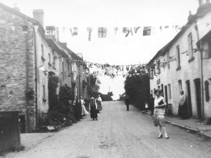 A joyful scene on Castle Green in Bishop's Castle in 1928, as local milkman Eddie Evans celebrated his wedding to Annie Russell of Easthope, near Much Wenlock. Well known and much loved in the town, Mr Evans delivered milk each day by pony and trap from his home at The Windmill. Captured amid the historic streets of Bishop's Castle, this photograph preserves a special community occasion and a glimpse of village life from nearly a century ago.