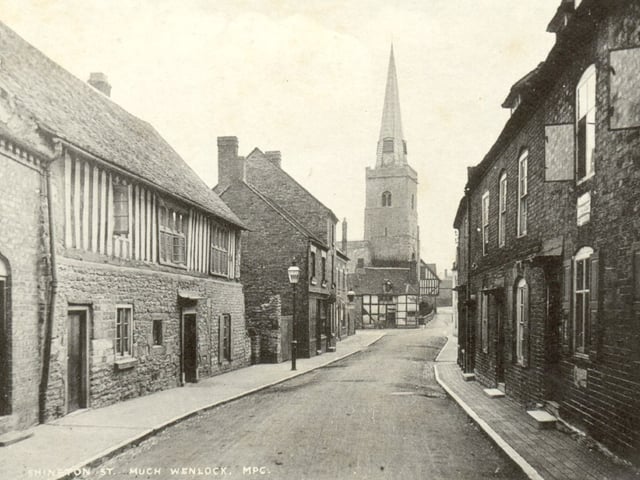 A timeless view of Sheinton Street in Much Wenlock, capturing a quiet street scene framed by the presence of Wenlock church. Taken from a “Souvenir Portfolio of Local Views” and thought to pre-date the removal of the church spire in late summer 1930, the image preserves a moment just before the skyline of the town was altered.