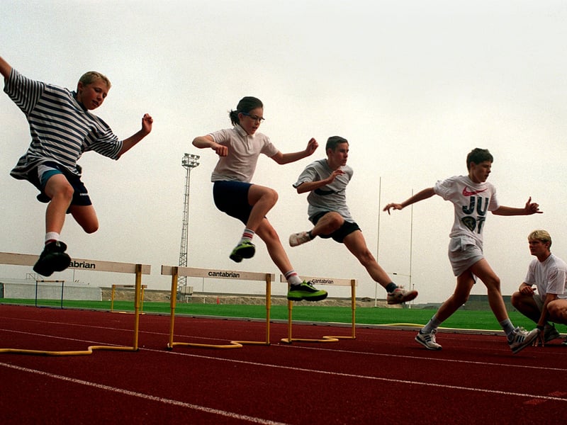 The City of Leeds begin its search for athletics stars of the future with the launch of Spar Track 1997, organised by Leeds City Council's Leisure Services Department.  Coach Matthew Gillard watches young athletes Robert Guest, Claire Connon, Adrian Smollett and Stuart Vincent.