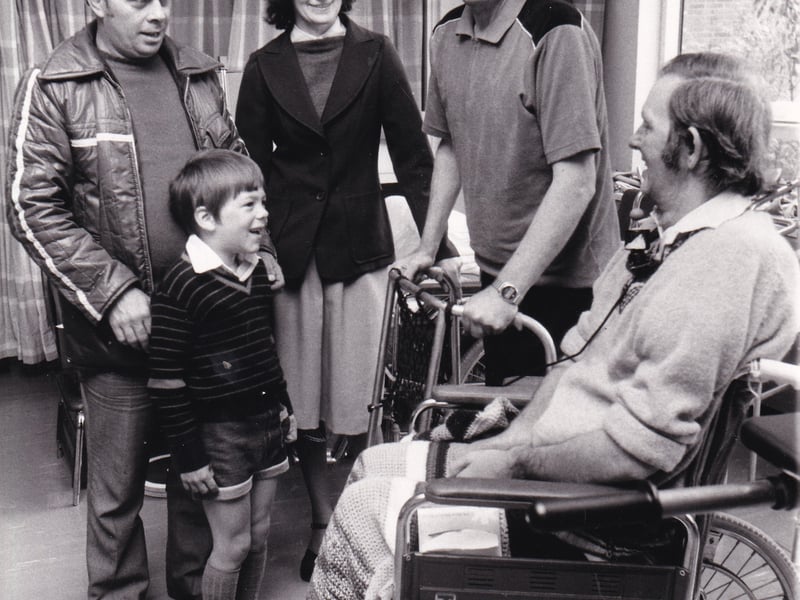 Jim Rutherford, his wife Debbie and their son Ian, six, chat with patients Joseph Chadwick, standing, and Keith Etchell at the open day of the Younger Disabled Unit at the Newton Green wing of Chapel Allerton Hospital in May 1981. 