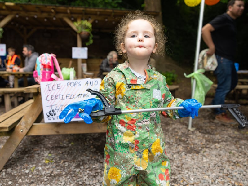 Isabella, three, cleaning up Foxes Forest  