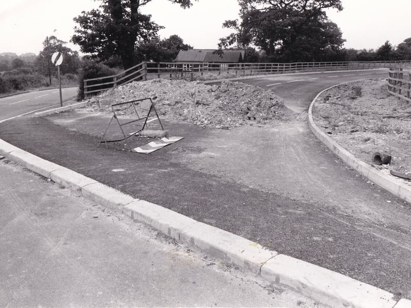 A road which goes nowhere in July 1981. The road which leads off the Whitkirk roundabout and comes to an abrupt half at School Lane was described as a "ghastly charade" by former county councillor Margaret Suttenstall. It had been built as the first phase of a new access road to the proposed multi million pound housing development at Colton and would eventually link up with Bullerthorpe Lane.