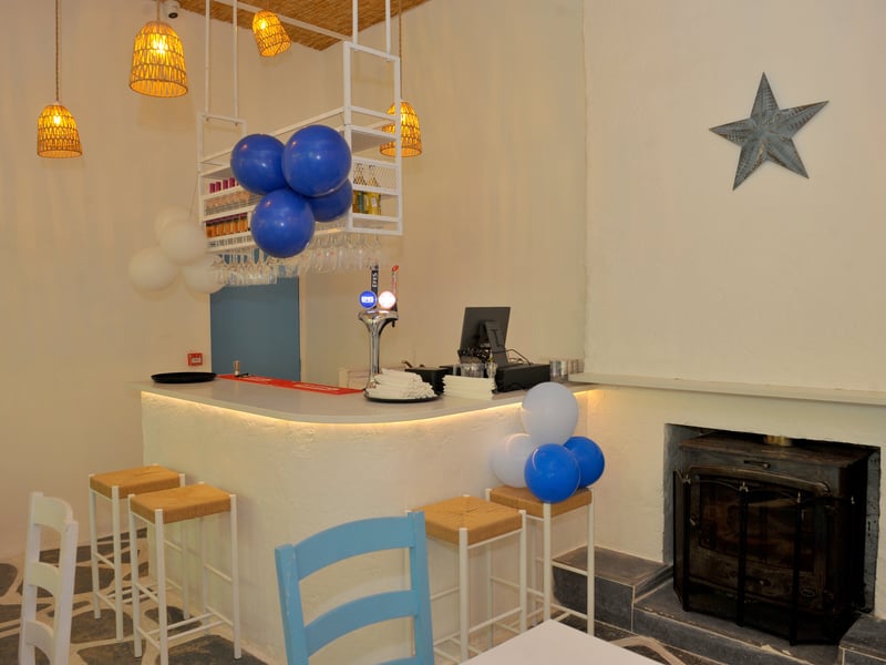 The new Souvlaki Corner is a larger space, offering plenty of seating, with both dine-in and takeaway options, as well as a bar area.