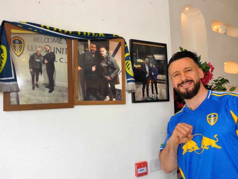 Leeds United fan and owner Blerim Lama with his prized pics with Ezgjan Alioski and Kalvin Phillips.