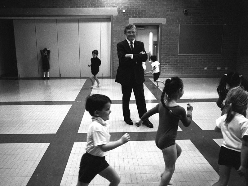 Headteacher Alan Padden with pupils in the assembly hall at Adel Primary School, Leeds, in 1992