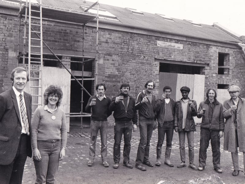 Coun Michael Simmons, chairman of Leeds City Council Inner City Sub-Committee with Mary Ludbrook, chairwoman of the Meanwood Urban Valley Farm and Manpower workers at the topping out ceremony of a renovated barn in April 1983.