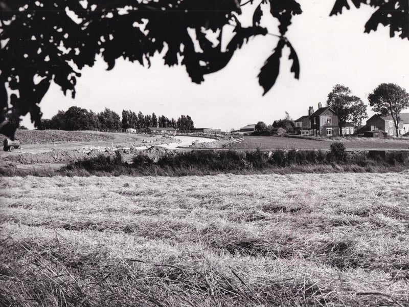 A picturesque view of rural Colton in September 1980 with its farm houses and hay barns - and the new roads being built for massive housing development.