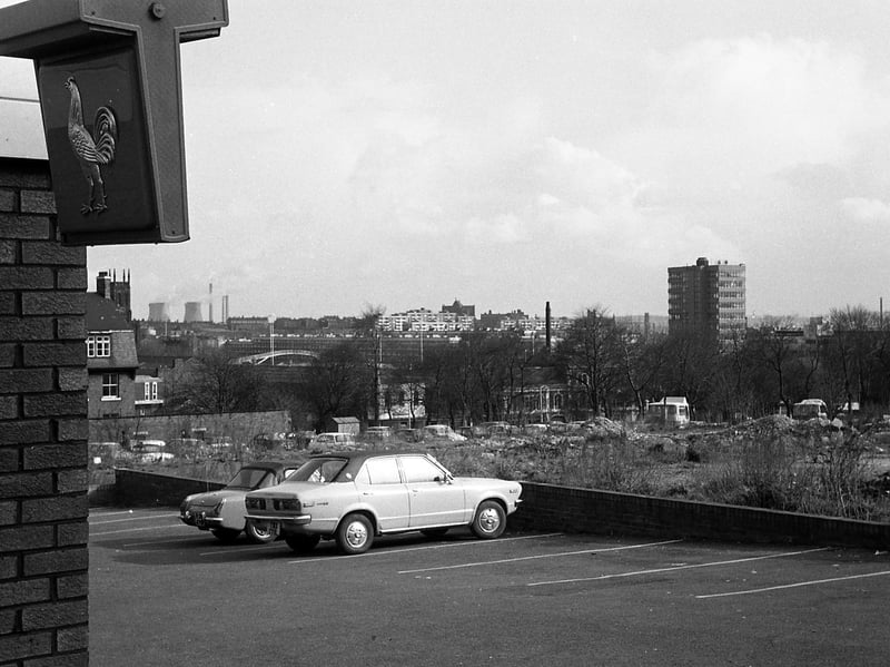 A view taken from the car park of the Hobby Horse pub on Lovell Park Road, looking south-east in 1970. Waste ground beside the car park has since been redeveloped with new housing. The tower block to the right is the British Gas tower on New York Road. The view looks towards Quarry Hill Flats and Saxton Gardens in the centre.