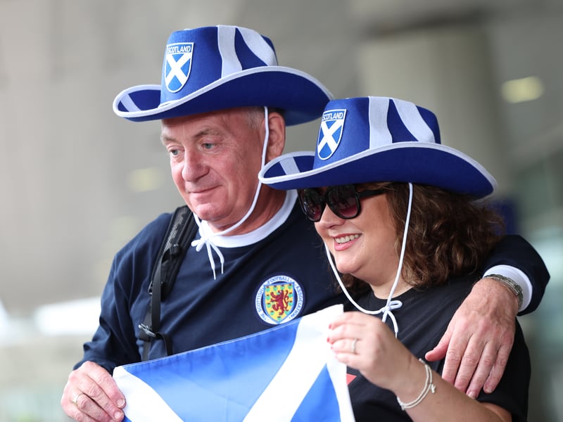 Two Scotland fans on their way to the United States for the World Cup this summer.