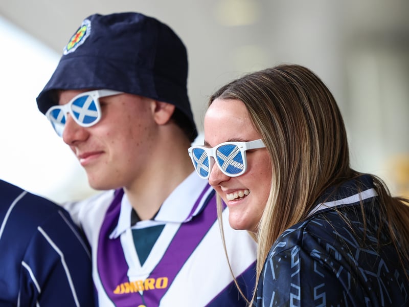 Scotland fans are pictured at Glasgow Airport travelling to the World Cup.