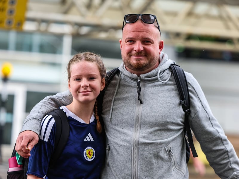 Scotland fans are pictured at Glasgow Airport on the way to the World Cup.
