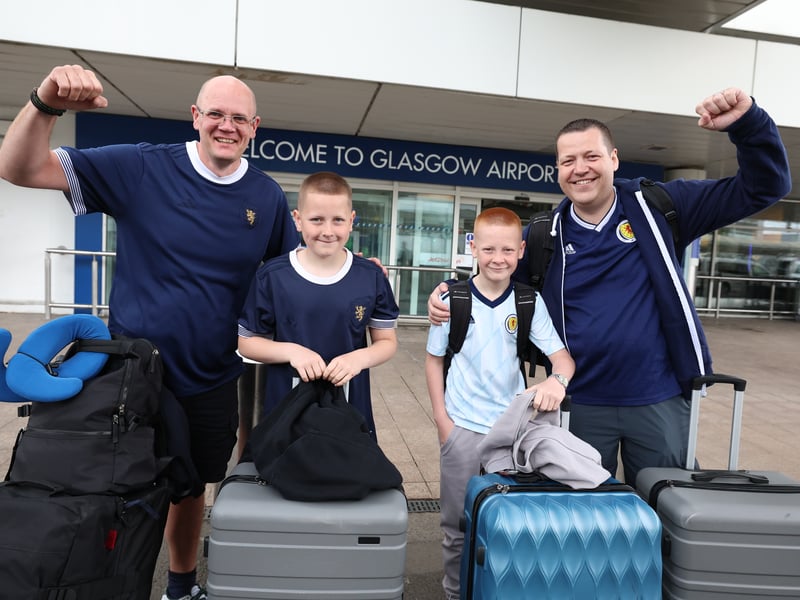 Fans head to the World Cup from Glasgow Airport on Wednesday morning.