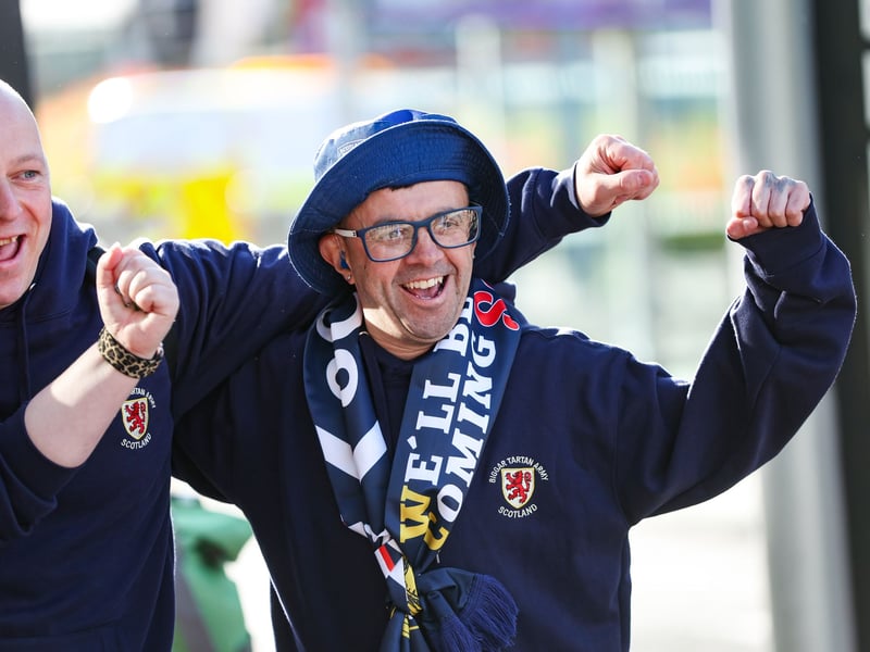Two Scotland fans prepare to jet off to the World Cup at Edinburgh Airport.
