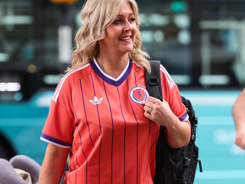 A Scotland fans dons the popular Scotland away kit on the way to the World Cup in the United States.