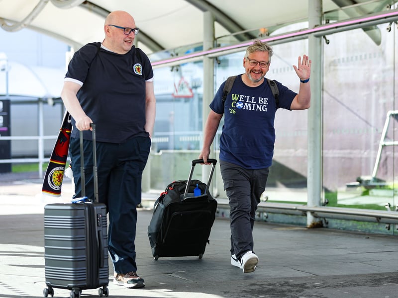 Scotland fans are pictured at Edinburgh Airport.