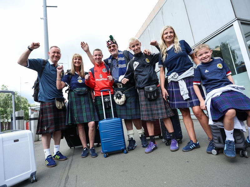 A group of Scotland fans pose for a photo before jetting off to the United States.