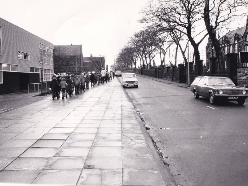 This photo, looking up Hough Lane, shows the distance pupils at St Peter's School had to walk assembly in February 1974. Children, assisted by staff, had to cross the road from the school annexe, left, and enter through the top gate of the main building, right.