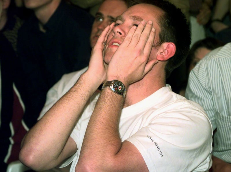 A fan is disconsolate after watching Argentina score from a penalty.