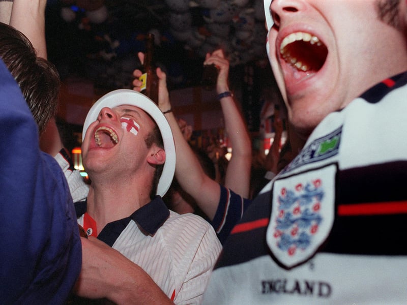 Fans at Brannigan's celebrate Paul Scholes goal against Tunisia.