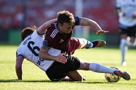 Galway United's Ed McCarthy is tackled by Aodh Dervin of Dundalk in Turner's Cross Stadium in Cork.