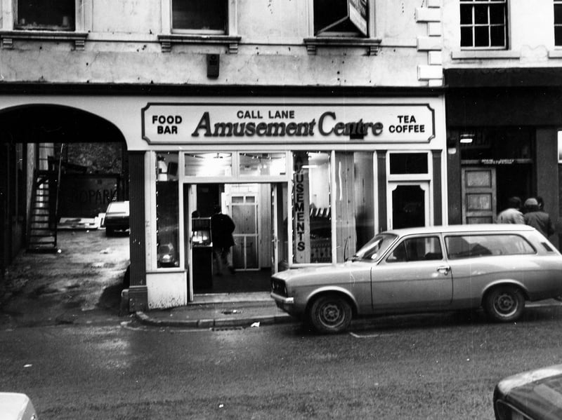 Call Lane Amusement Centre at No.32 Call Lane with the Star and Garter public house on the right. A passageway on the left leads to the back of the buildings with a flight of steps visible. Pictured in December 1979.