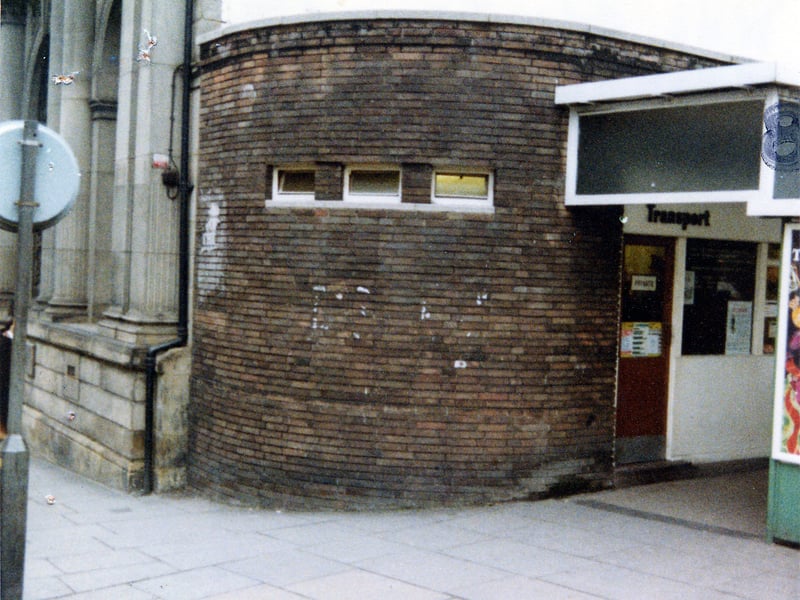 The West Yorkshire Passenger Transport Executive's Transport Information Office on the corner of Kirkgate and New Market Street, a round brick building in front of the Trustee Savings Bank. Pictured in December 1979.