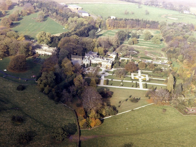 A bird's eye view of Lotherton Hall taken in 1979 from the Skyview Aerial Archive. The Hall is visible in the centre with its formal gardens. Behind Lotherton Hall to the right the Bird Garden is under construction.