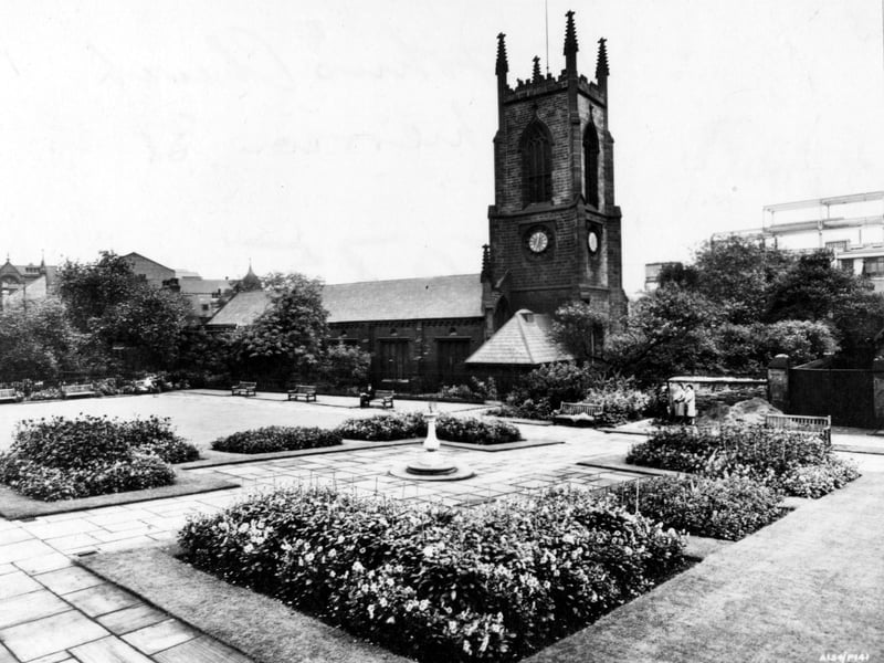 St. John's church on Merrion Street in June 1948. The gardens are also visible and have neat and tidy boarders. A sun dial can be seen in the centre of the garden.
