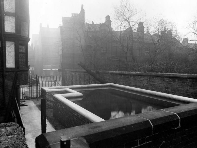 A static water supply tank located behind Warwickshire furniture store, at 15-19 Merrion Street. Pictured in April 1943.