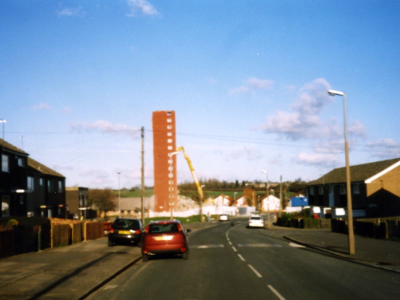 Swarcliffe Avenue towards the high-rise flats of Langbar Towers in the process of demolition.