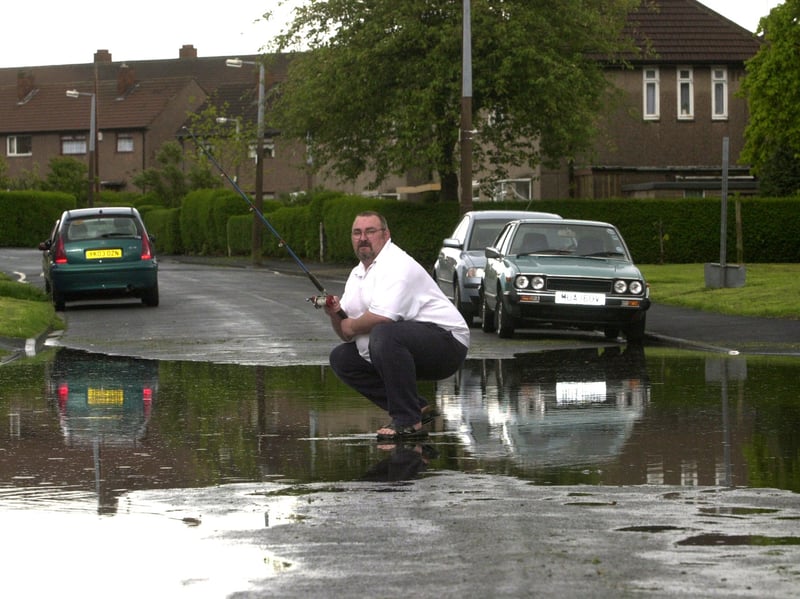 Southwood Road resident Ken Teale was complaining about flood water on his street. Pictured in May 2003.