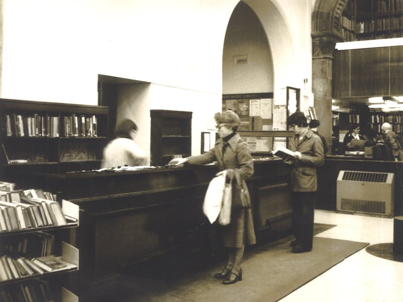 The public counter in the Central lending Library on the ground floor of Leeds Central Library. The mezzanine of the Music Library can be seen to the right. Pictured circa 1977.