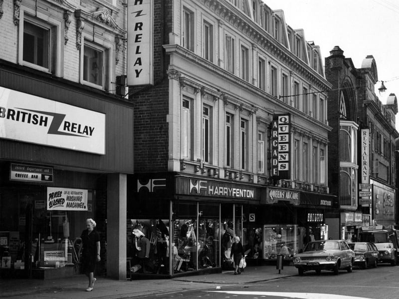 A view from The Headrow with Queen's Arcade on the left. Shops visible include British Relay, Harry Fenton and a restaurant