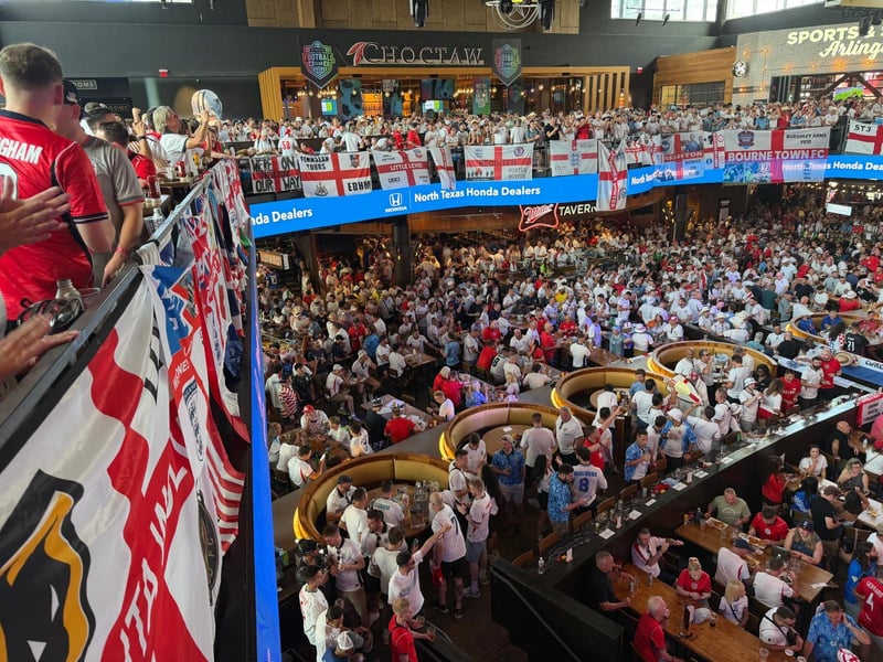 Fans pictures in the bar and food area outside the stadium in Dallas ahead of England's clash against Croatia. 