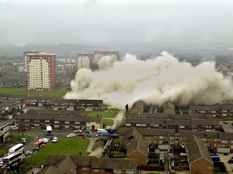 Dust cascades across the Swarcliffe estate from the remains of the two blocks of flats that were demolished in March 2001.