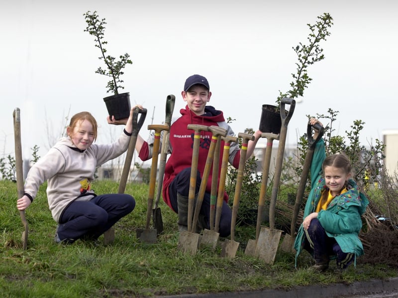 Tree planting by members of St Gregorys Youth and Adult Centre in March 2002. Pictured are Beth Matthews, left, and Stephanie Ceaward joining volunteer Jamie Lawson.