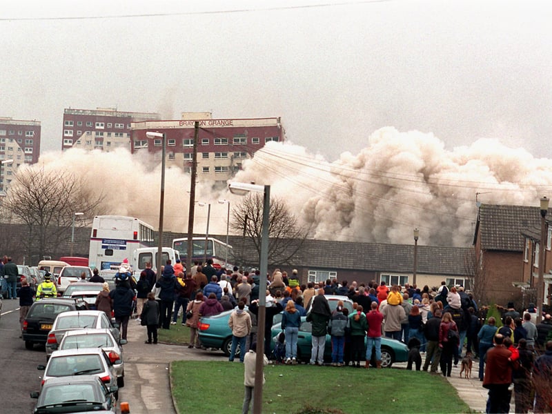 Locals watch on as Brayton Grange followed by Farndale Court come crashing down in March 2001.