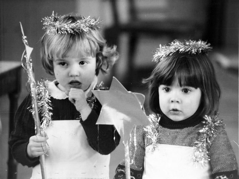 Lyndsey Barron (left) and Emma Sutcliffe, both aged three, playing fairy dolls in their school's Christmas concert in December 1981
